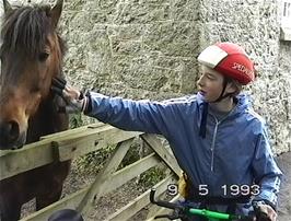 Alex Lessware makes a new friend in the paddock next to Lustleigh Baptist Church
